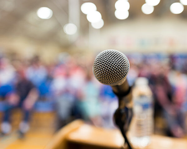 Close up of microphone on a podium in an auditorium