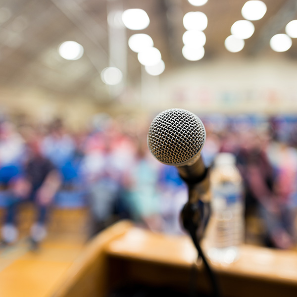 Close up of microphone on a podium in an auditorium