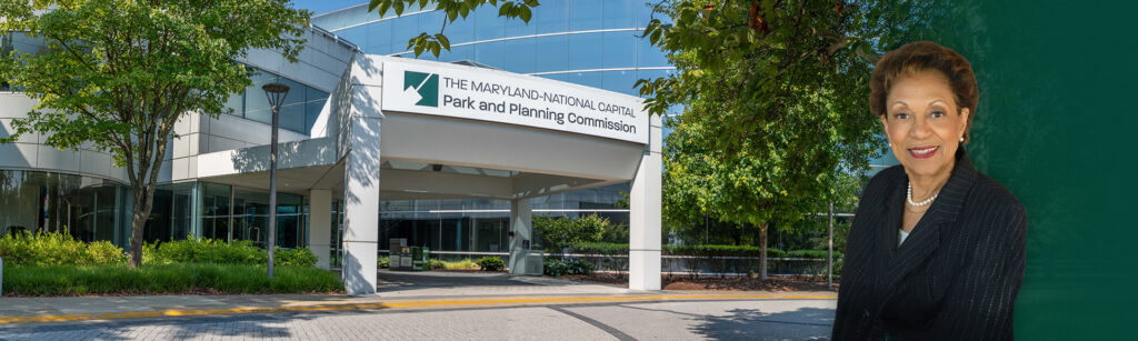 An image of the front door of the Maryland-National Capital Park and Planning Commission, Largo Headquarters; and new Commissioner, Gloria Gary Lawlah.